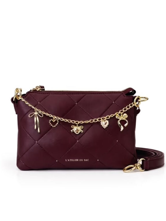 Borsa L’ Atelier du Sac Alexia L’ Allure pochette a tracolla nera trapuntata con catena e charm pendenti