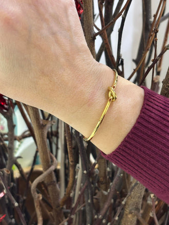 Bracciale rigido nodo Cheriè in acciaio dorato